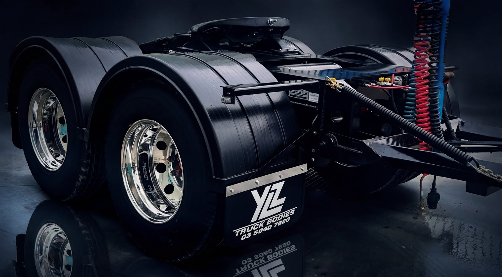 YLZ twin axle converter dolly — chrome wheels, SAF air suspension, YLZ-branded mudflap